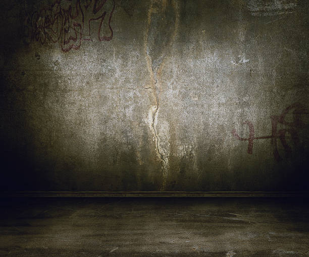 Grunge wall interior with graffiti tags stock photo