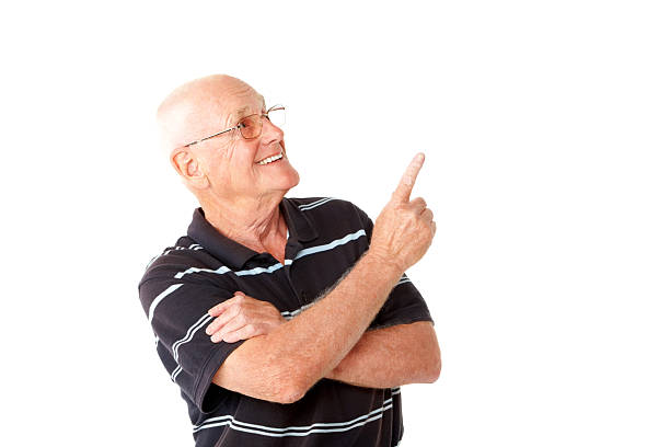istock Handsome senior man showing copyspace on white 463541317