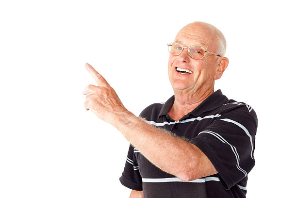istock Happy senior man showing you copyspace 463541345