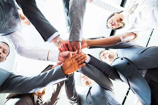 istock Working together.... hands of business team showing unity 463546133