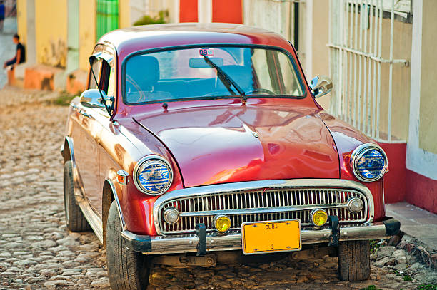 Car on one of narrow streets of Trinidad, Cuba