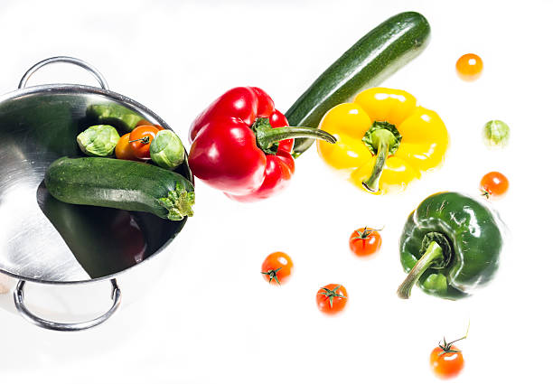 istock mixed colorated peppers on white background 463547381