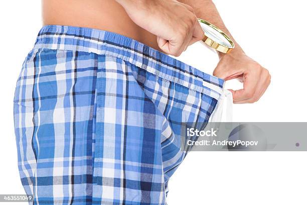 Man Looking In His Underwear Stock Photo - Download Image Now - Penis, Men, Scale