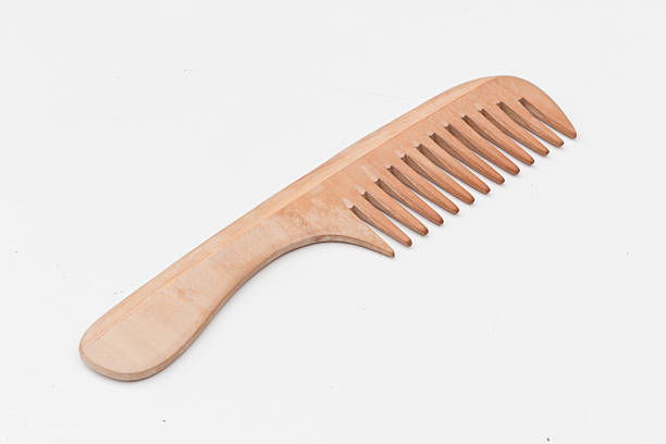 istock Wooden comb isolated on white 463551685
