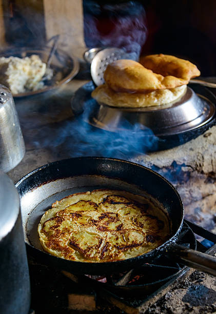 Apple pancake and Gurung breads Preparing apple pancake and Gurung breads in nepal apple cinnamon pancake stock pictures, royalty-free photos & images