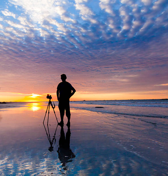 istock Silhouette of a photographer at sunset 463554573