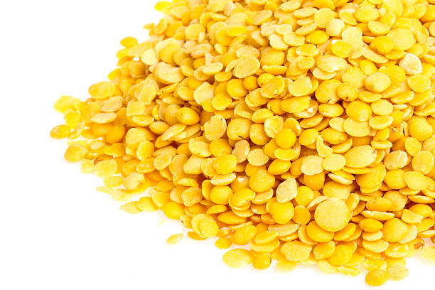 istock Yellow lentils isolated on white background. Macro shot 463559029