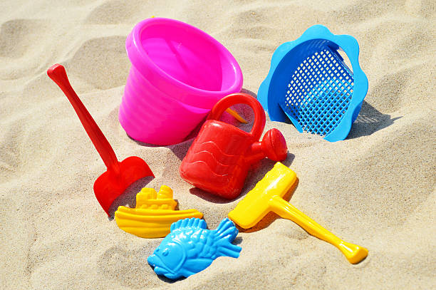 istock Plastic children toys on the sand beach 463559645