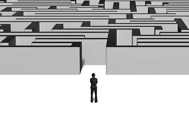 istock Businessman standing in front of maze 463559917