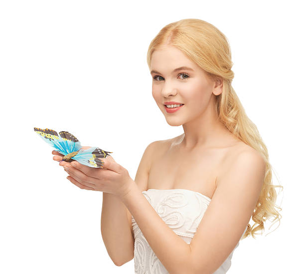 istock woman with butterfly in hand 463561243