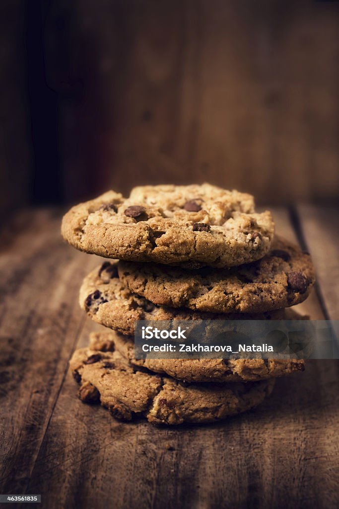 Chocolate cookies on wooden table. Stacked Chocolate cookies on wooden table. Stacked Chocolate chip cookies shot  closeup Cookie Stock Photo