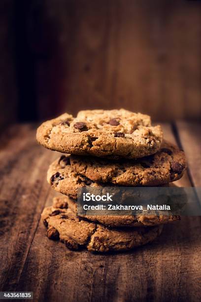 Chocolate Cookies On Wooden Table Stacked Stock Photo - Download Image Now - Cookie, Baked, Block Shape