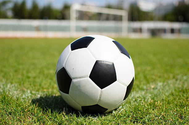 istock Football on soccer field 463571479