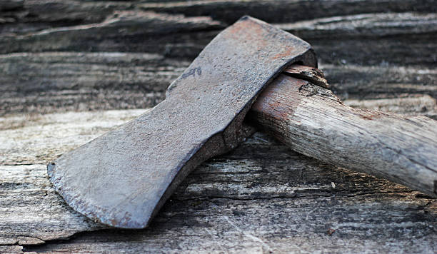 Rusty Axe on wood stock photo