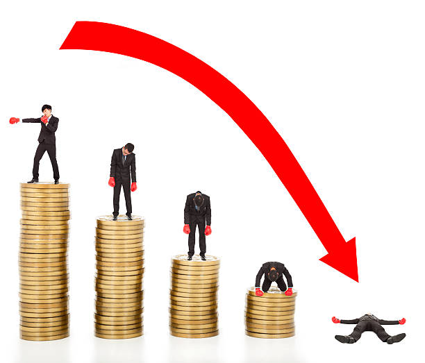 istock businessman lose coins with a red arrow going down 463576405