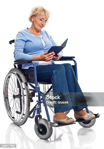 Mature Woman In Wheelchair Stock Photo - Download Image Now - Wheelchair, White Background, Cut Out