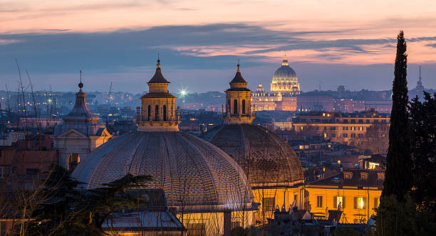Cityscape with church cupolas at dusk, Rome Italy