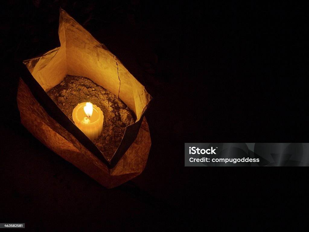 Christmas Eve Luminaria A luminaria, also called a farolito, is one of many set out every Christmas Eve in New Mexico, part of a long tradition. Luminarias are created with paper lunch bags, sand, and votive candles. Luminaria Stock Photo