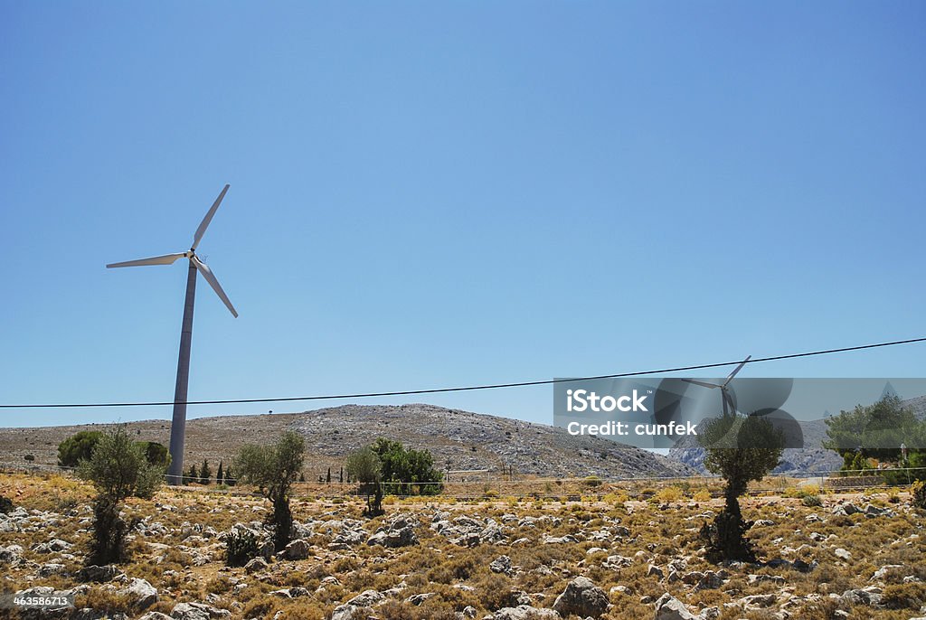 Chios mainland with windmill Chios road up in the hills with windmillby the road Agriculture Stock Photo