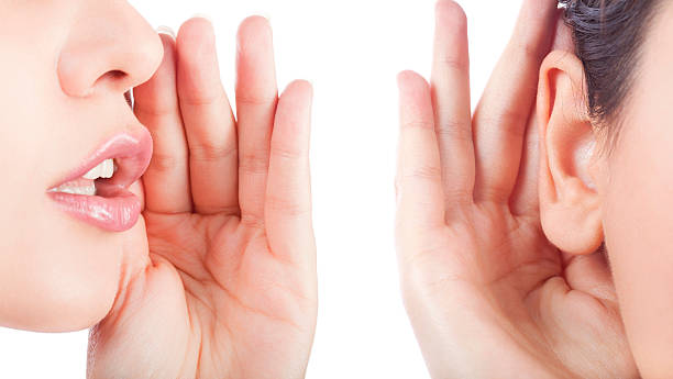 囁く - listening human ear communication human hand ストックフォトと画像