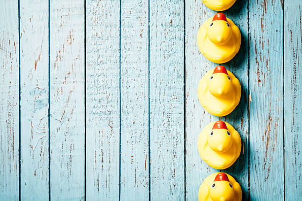 Rubber Ducks on Blue Vintage Wood Background - Grunge Old