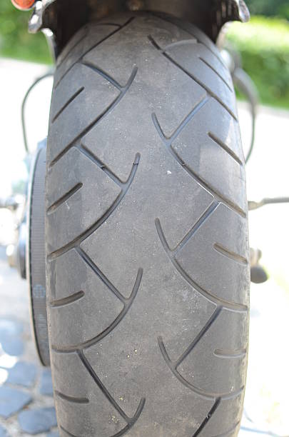 istock Motorcycle tire and exhaust close up 463600907