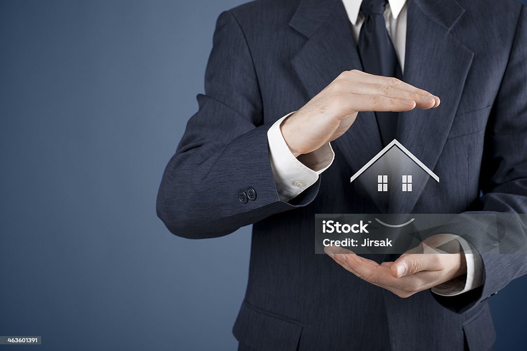Property insurance Property insurance and security concept. Protecting gesture of woman and symbol of house. Adult Stock Photo