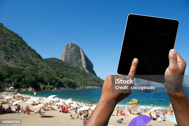 Brazilian Hands Using Tablet At Sugarloaf Rio De Janeiro Brazil Stock Photo - Download Image Now
