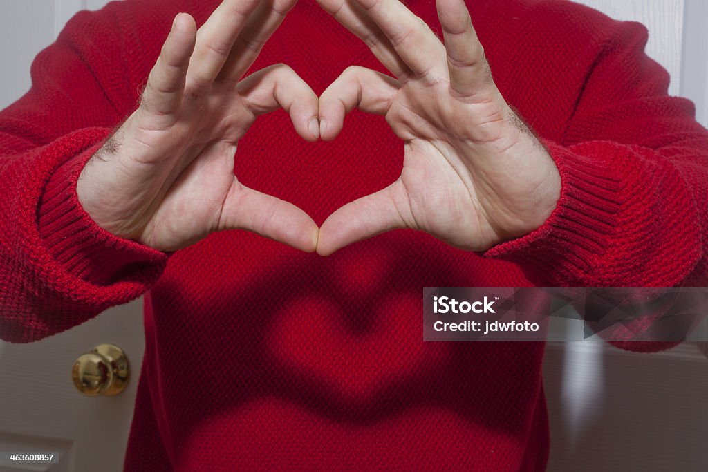 Heart Shaped Gesture A heart shaped gesture made with a hand sign. Shadow Puppet Stock Photo