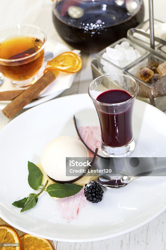 cream dessert dessert, a piece of cake on the table with a cup of tea Berry Fruit Stock Photo