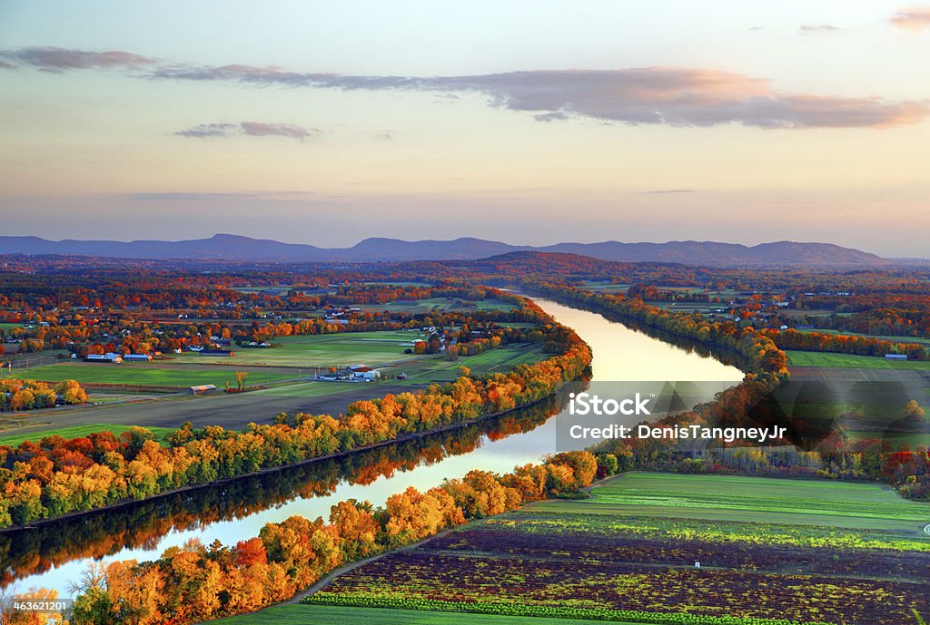 Connecticut River in Autumn Connecticut River winding through the Poineer valley region of Massachusetts. Photo taken from a scenic viewpoint on Sugurloaf Mountain in Sunderland  at dusk. The Pioneer Valley is known for its scenery and as a vacation destination and its beautiful fall foliage ranks with the best in New England  Massachusetts Stock Photo