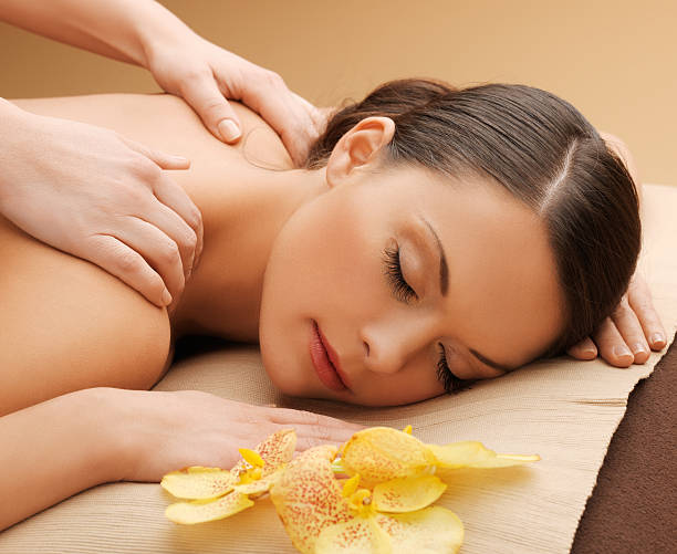istock beautiful woman in massage salon 463627107