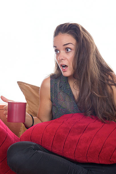 istock shocked woman with coffee 463627167