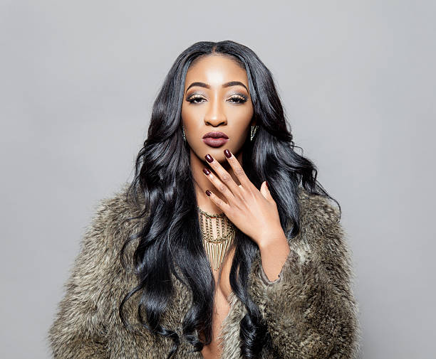 istock Black beauty with elegant curly hair 463629895