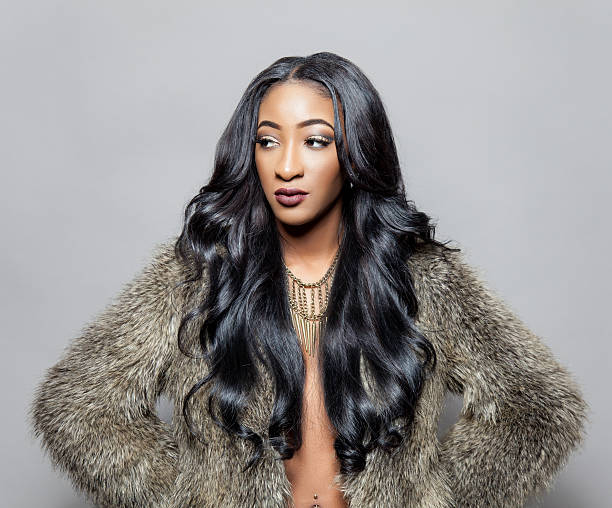 istock Black beauty with elegant curly hair 463630859