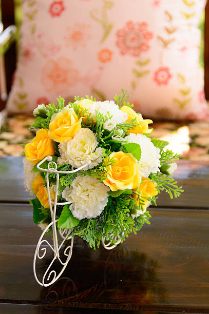 istock beatiful plastic bouquet of flowers on wooden table 463634301