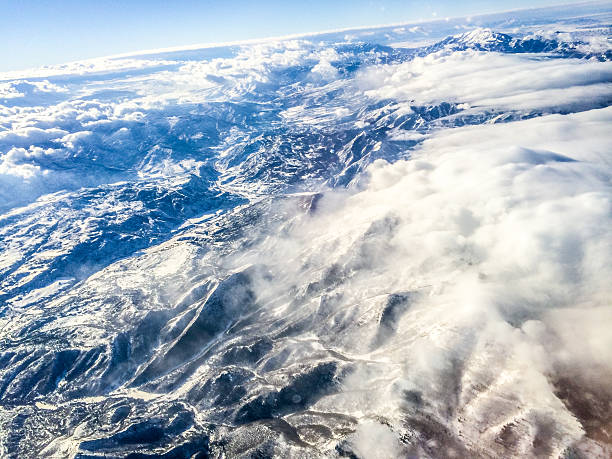 Aerial View on Utah Mountains covered with snow and clouds