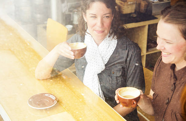 istock Friends chatting in a coffee shop 463649031