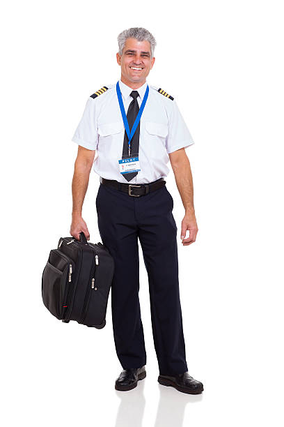 istock middle aged airline pilot carrying briefcase 463650685