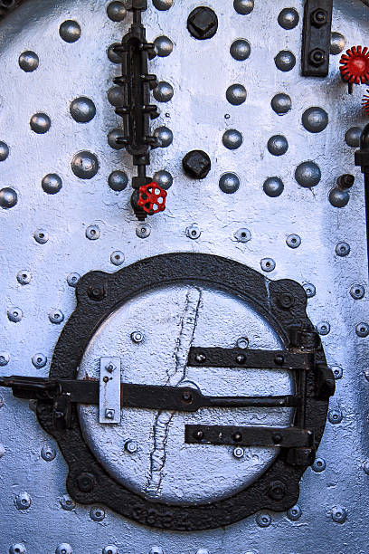Firebox The firebox and values on a antique steam train. firebox steam engine part stock pictures, royalty-free photos & images