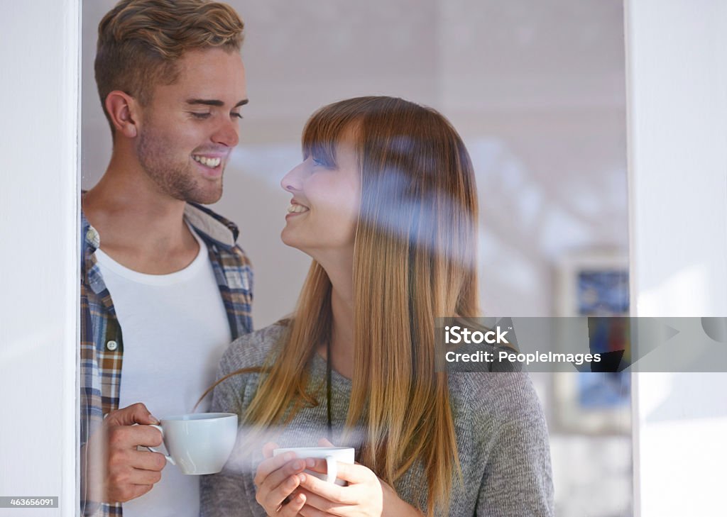 My perfect morning Young couple standing and drinking coffee together at home 20-24 Years Stock Photo