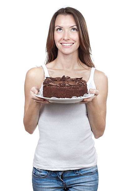 istock beautiful brunette woman holding chocolate cake 463671329