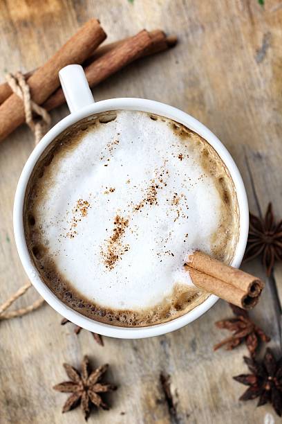 istock hot cappuccino with spices cinnamon sticks and star anise. 463673805