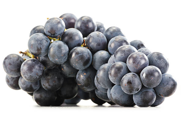 istock Bunch of fresh red grapes isolated on white 463675323