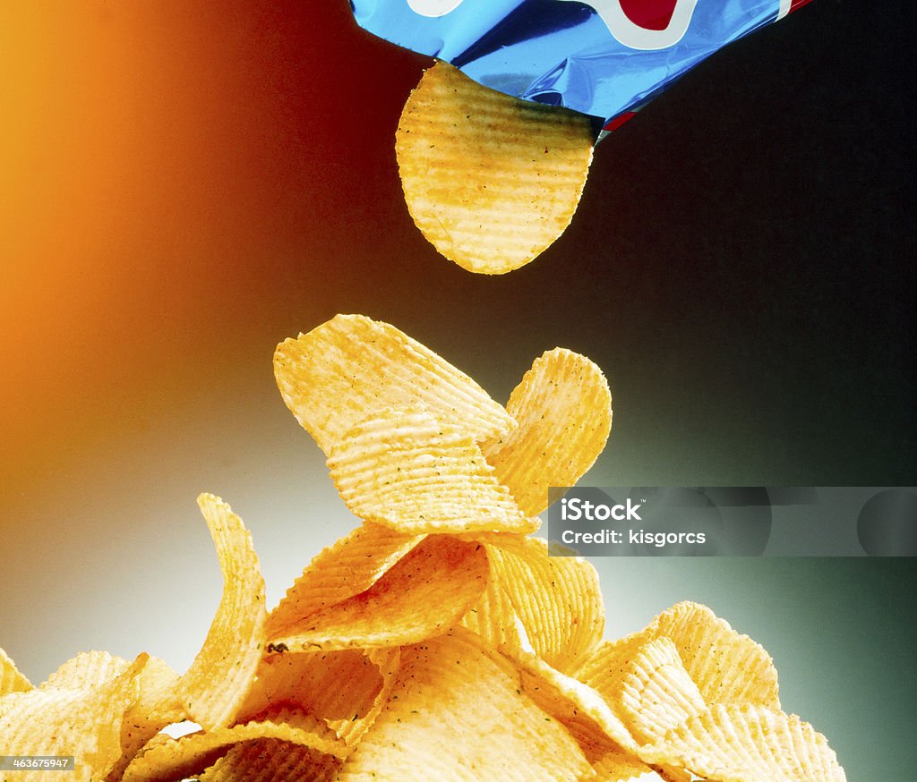 Potato chips Potato chips and bag on color background Bag Stock Photo