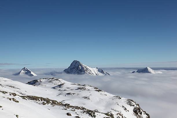 Peaks over the clouds stock photo