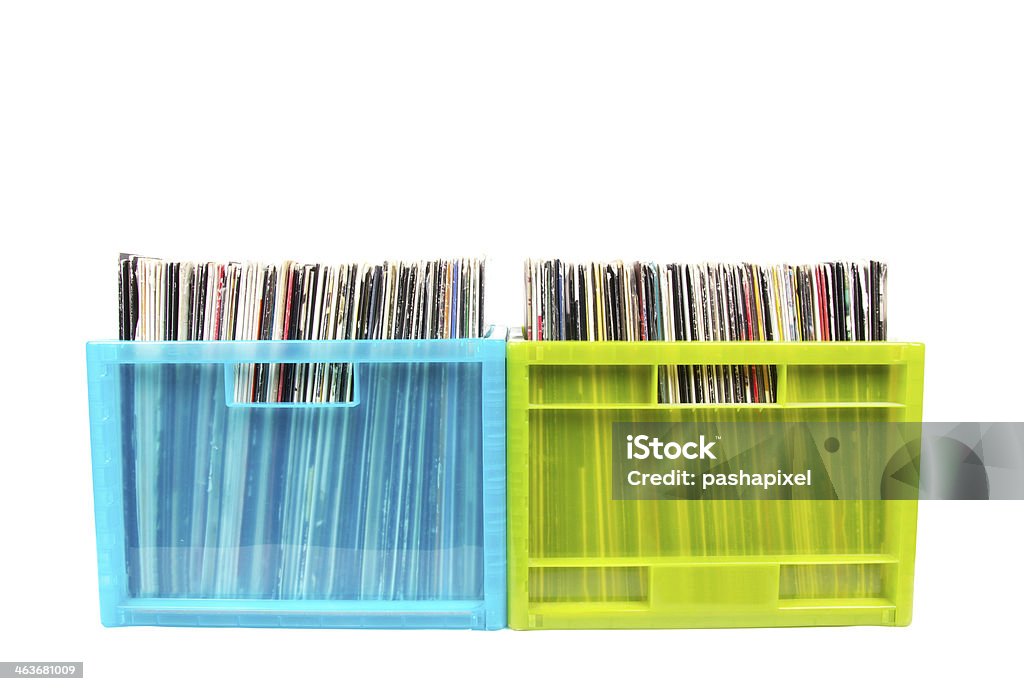 Old dj records collection in plastic boxes Old records in colour plastic boxes on white, closed up Abstract Stock Photo