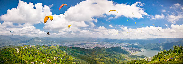 istock Paraglider flying against the Himalayas, Nepal. 463682003