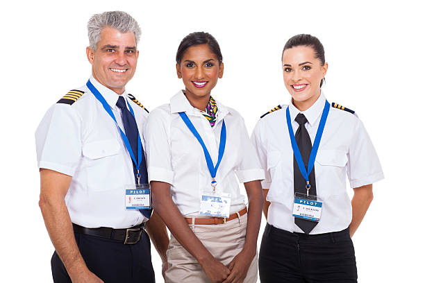 istock airline crew standing on white background 463692779
