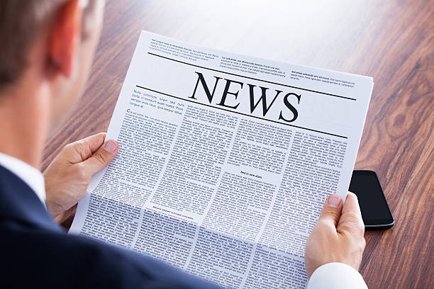 istock Businessman Reading Newspaper 463693781